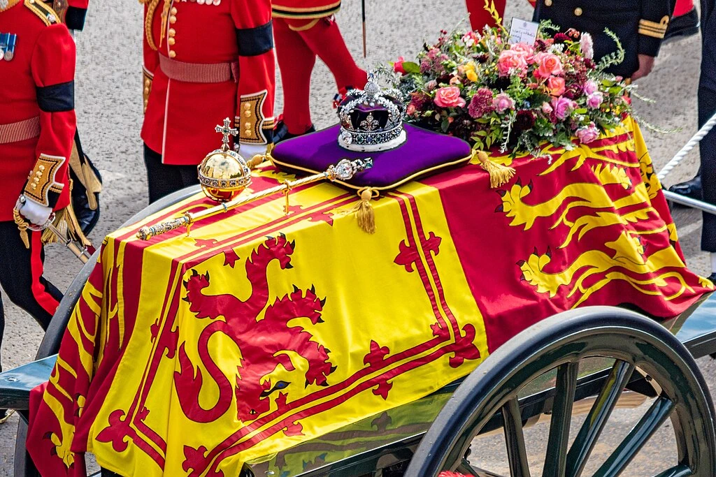 The funeral procession for Queen Elizabeth II departed from Westminster Abbey; the coffin was placed on a gun carriage, which was towed by 142 members of the Royal Navy through the streets of central London. The coffin was taken to Wellington Arch through central London ahead of the journey to Windsor for the burial.