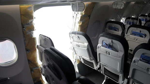 An opening is seen in the fuselage of an Alaska Airlines Boeing 737-9 MAX on January 7, 2024 in Portland, Oregon. A door-sized section near the rear of the plane blew off 10 minutes after Flight 1282 took off from Portland on January 5. National Transportation Safety Board via Getty Images