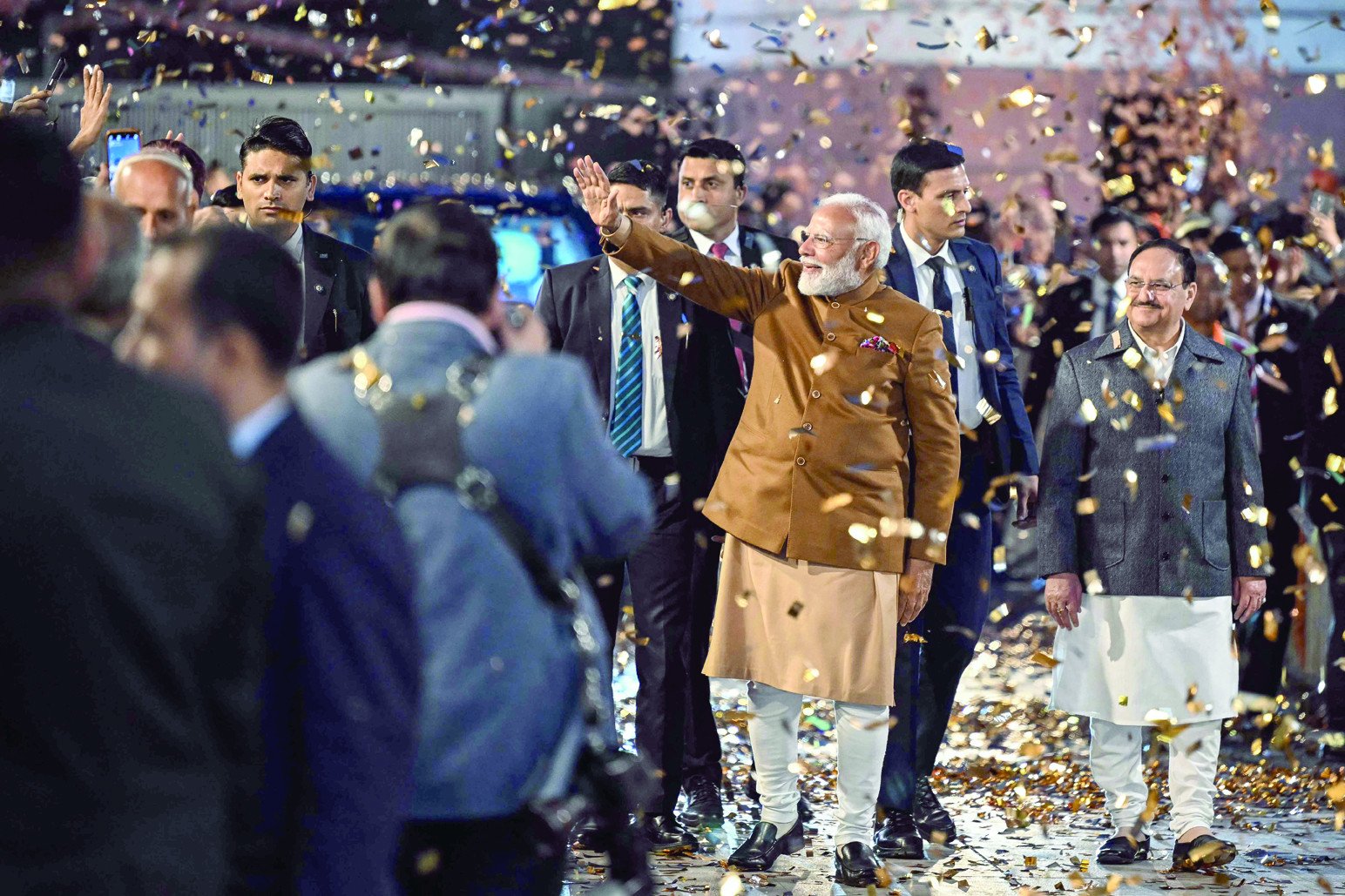 Indian Prime Minister Narendra Modi greets supporters upon arriving at the Bharatiya Janata Party (BJP) headquarters in New Delhi to celebrate the party’s victory in the Delhi legislative assembly election. PHOTO: AFP