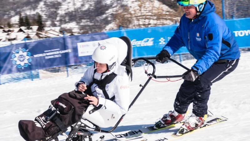 MATP (Motor Activity Training Program) Special Olympics Italia athlete Samuele Tron and his coach Andrea Tron during the adaptive ski demonstration in Bardonecchia, Italy at the Special Olympics World Winter Games Turin 2025. MATP is our Special Olympics movement-based sport program for athletes with profound intellectual disabilities who have high support needs.